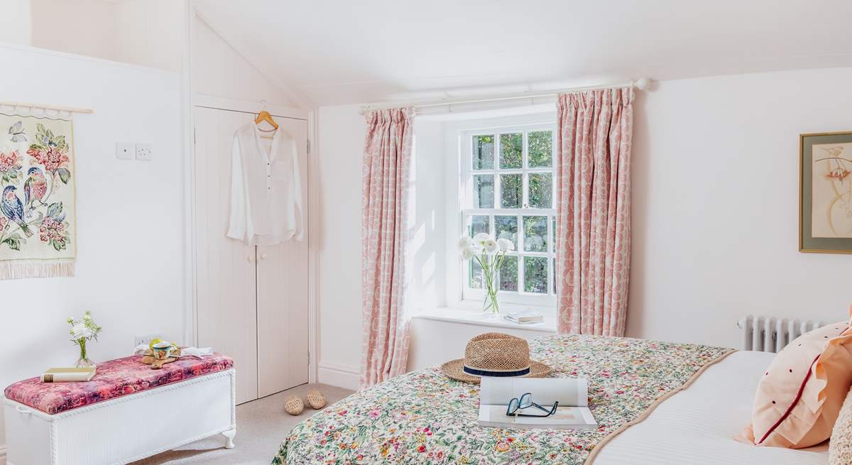 Bedroom 2, is a cosy space with a double bed and finished with a country-chic style.