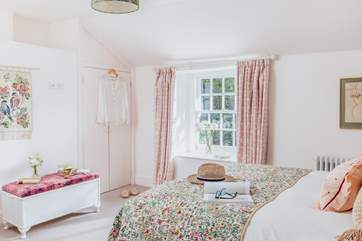 Bedroom 2, is a cosy space with a double bed and finished with a country-chic style.