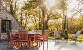 The outside dining-table is perfect for breakfast al fresco. - Thumbnail Image