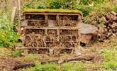 Overlooking the stream there's an adorable bug hotel which the owners’ children have created just for you. - Thumbnail Image