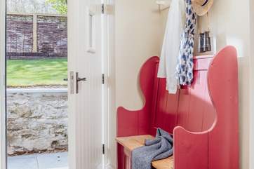 Arrive into a large hallway, with ample space for all of your holiday kit from welly boots to wetsuits, buckets to beach balls.