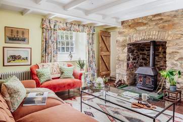 On winter days the sitting-room, complete with the original wood-burner, will be the heart of the home.