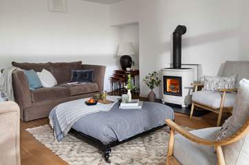 Open up the doors during the warmer weather and light the wood-burner when it gets cooler.
