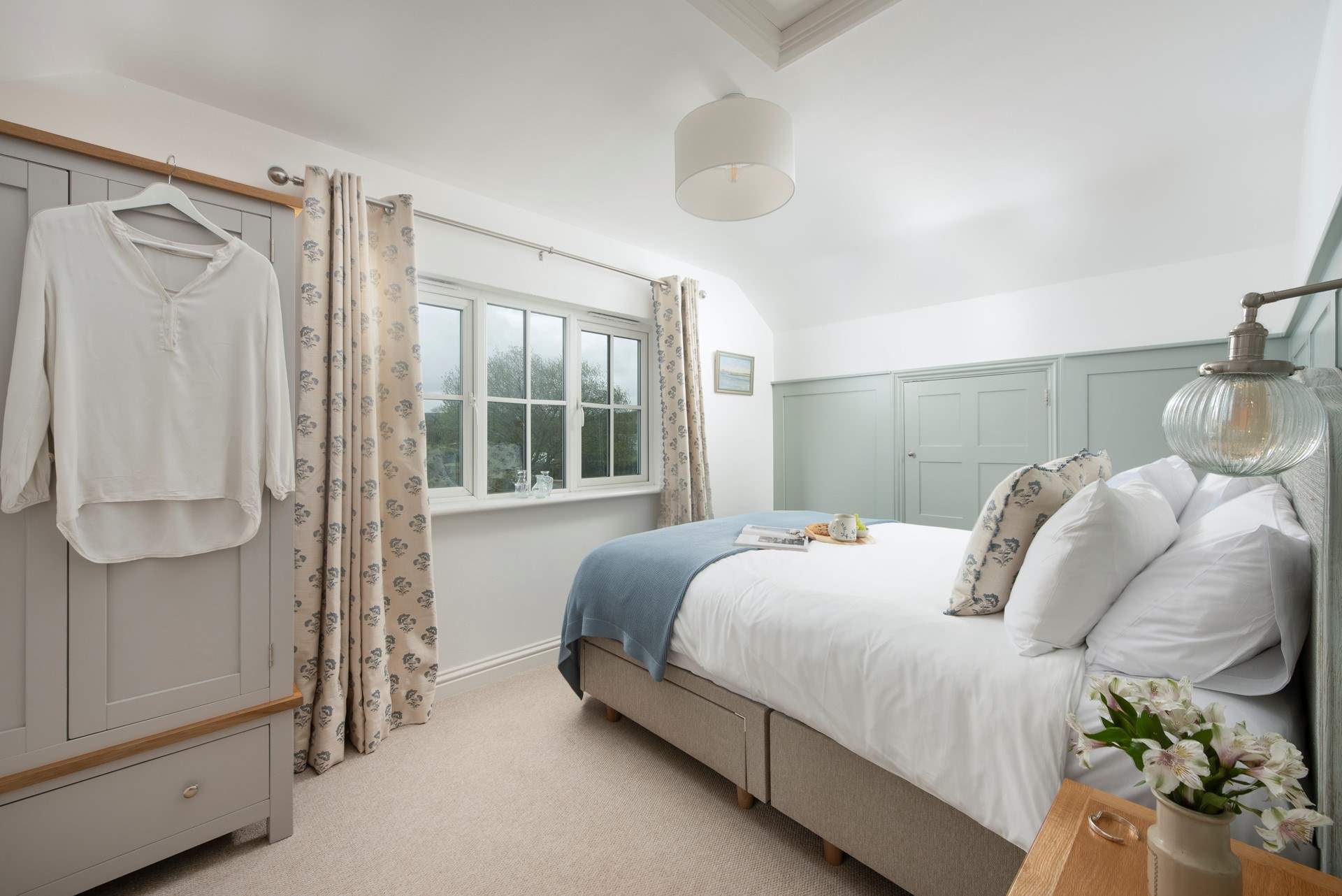 The second bedroom sits at the back of the cottage overlooking the garden.