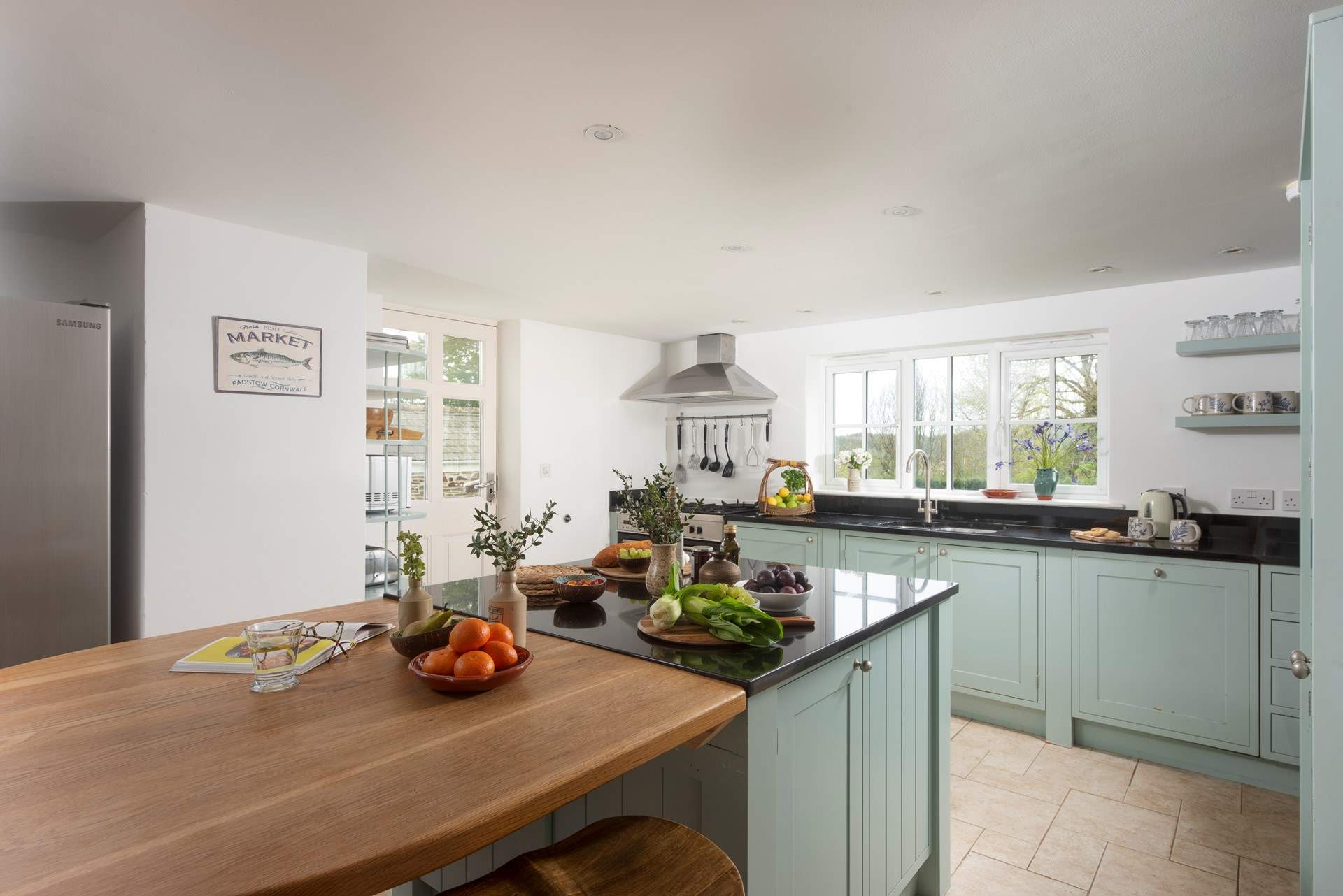 A door leads from the kitchen out to the terrace and garden.