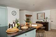 The breakfast-bar is the perfect spot for a quick breakfast, morning cuppa or a place to sit and keep the holiday cook company.