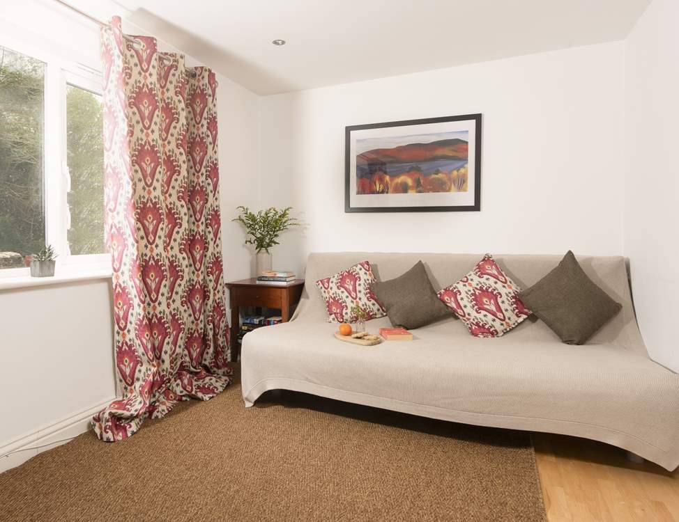 A little snug complete with a large TV leads off from the kitchen.