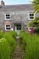Let us lead you up the garden path to this beautiful cottage.