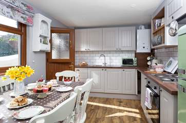 The bright kitchen/diner is a laid-back space for entertaining.