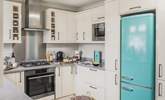 The open plan kitchen/dining area is a light and sunny space.  - Thumbnail Image