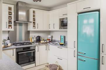 The open plan kitchen/dining area is a light and sunny space.
