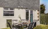 The sweet south-facing garden space is laid with artificial grass, perfect for little ones to play on. (please note the wall is low)  - Thumbnail Image