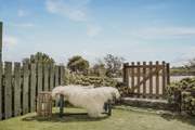 The sunny garden is lovely to relax in with a good book. The communal BBQ area is just opposite the garden.
