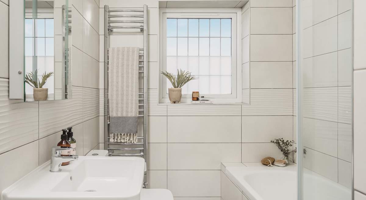 The contemporary family bathroom is also located on the first floor, the lovely bath is perfect for soaking in and daydreaming after a long day exploring Cornwall. 