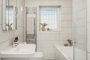 The contemporary family bathroom is also located on the first floor, the lovely bath is perfect for soaking in and daydreaming after a long day exploring Cornwall.