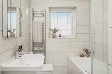 The contemporary family bathroom is also located on the first floor, the lovely bath is perfect for soaking in and daydreaming after a long day exploring Cornwall.