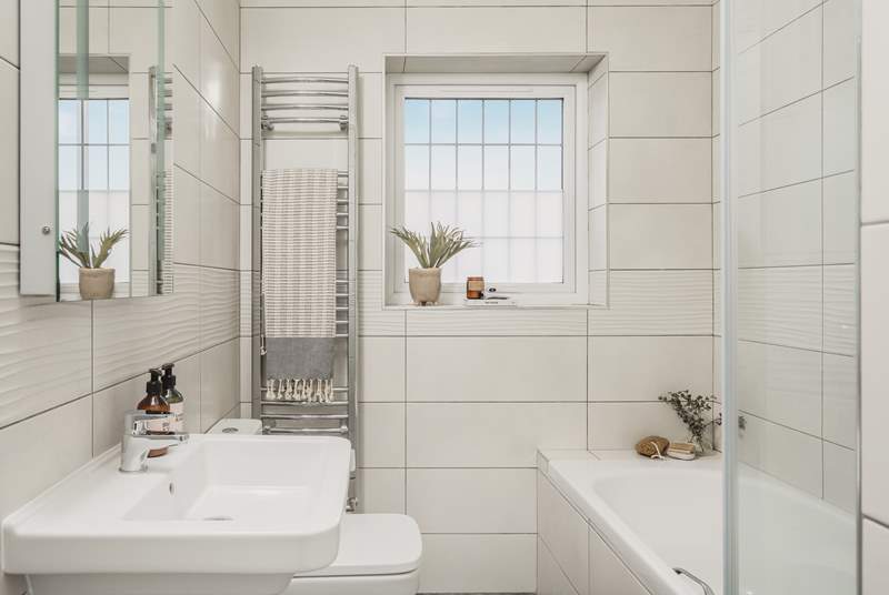 The contemporary family bathroom is also located on the first floor, the lovely bath is perfect for soaking in and daydreaming after a long day exploring Cornwall. 