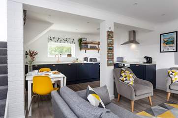 Walking in through the front door of this idyllic terraced cottage you enter the contemporary sitting-area which is open plan to the kitchen and dining area.