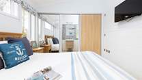 The main bedroom has a wonderful en suite shower, which is hidden behind the wardrobe doors.