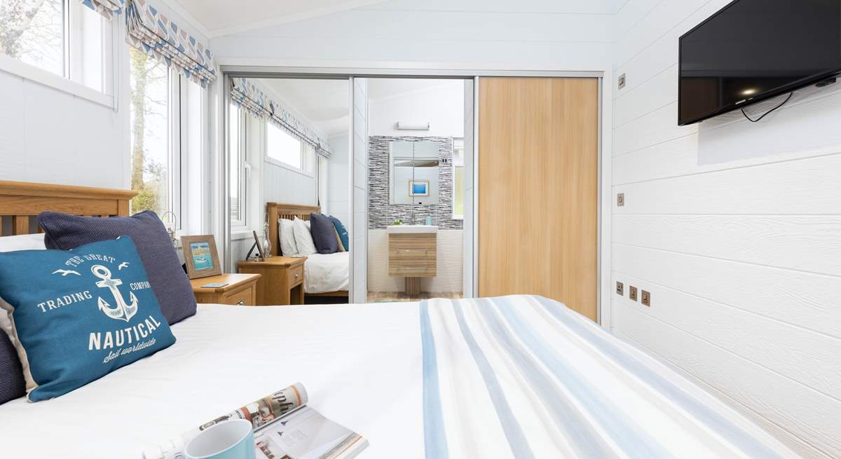 The main bedroom has a wonderful en suite shower, which is hidden behind the wardrobe doors.