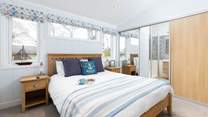 This bedroom benefits from a lovely en suite and additional television.