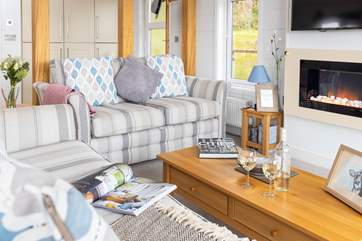 The living area offers the perfect place to sit back and relax whilst reading a book or watching a film.