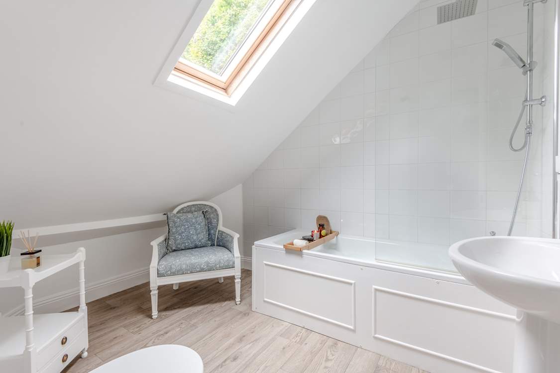 The fabulous bathroom. Enjoy a relaxing soak or a refreshing rainfall shower.