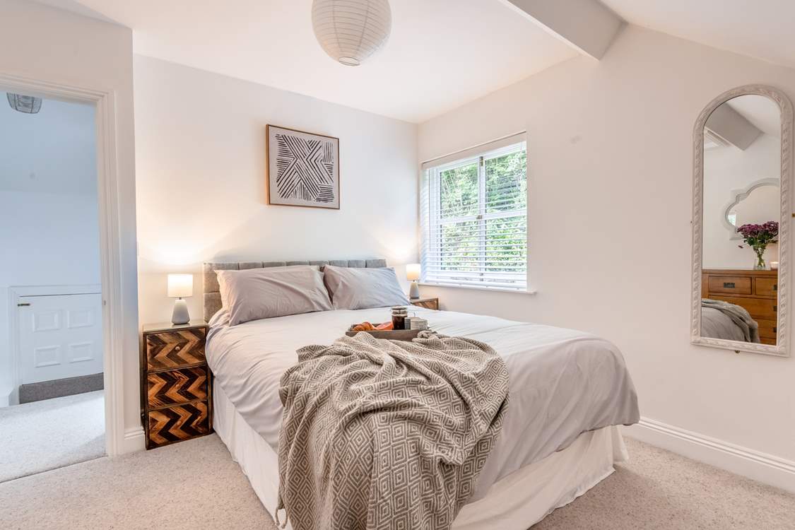 Elegant bedroom 1 has a super comfy king-size bed.