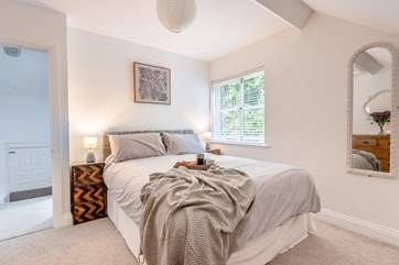 Elegant bedroom 1 has a super comfy king-size bed.