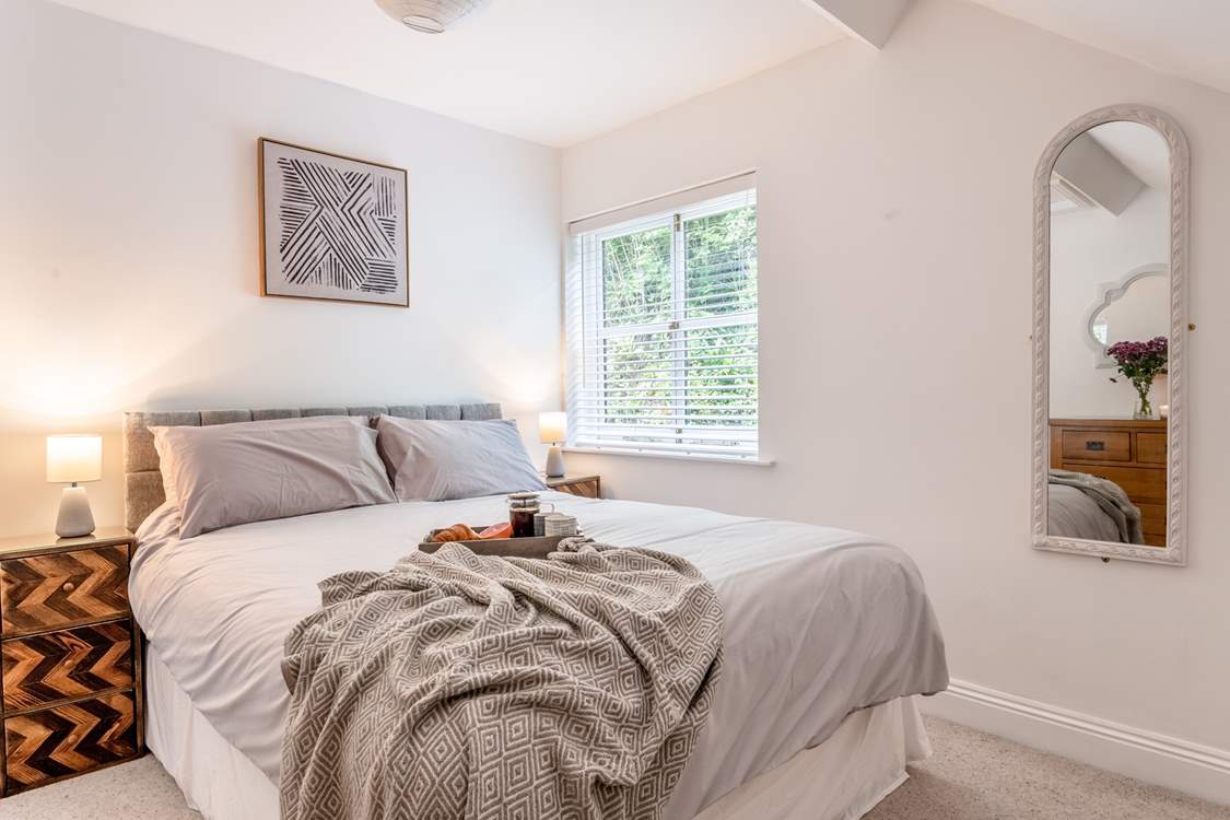 Bedroom 1 is a delight with king-size bed and high vaulted ceilings.