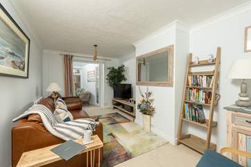 The sitting-room flows into the conservatory making this an excellent space for socialising together.