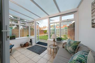 The pretty conservatory leads to the garden.