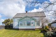 Spend time in the enclosed front garden or in the large enclosed lawned garden to the rear.
