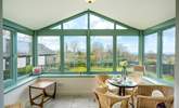 The spacious conservatory overlooks the front garden. - Thumbnail Image