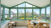 The spacious conservatory overlooks the front garden.