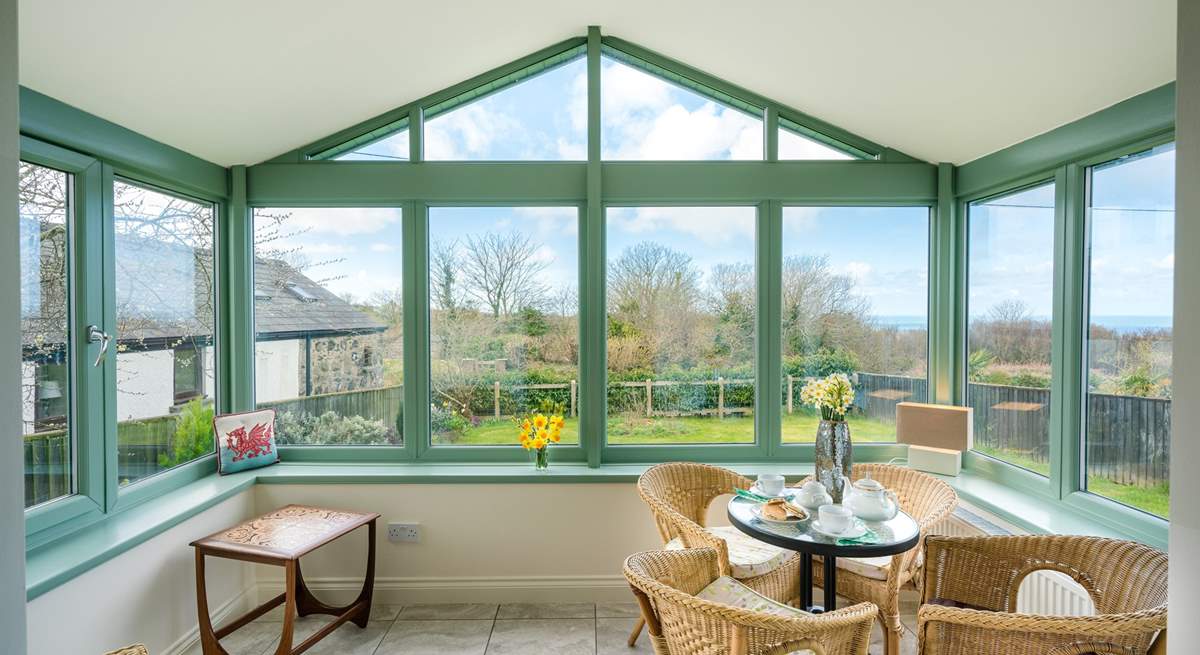 The spacious conservatory overlooks the front garden.