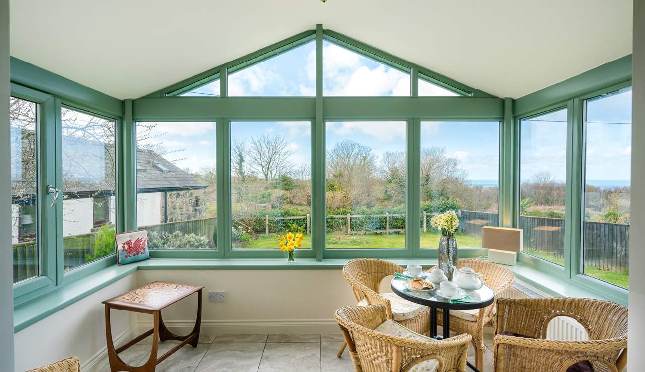 The spacious conservatory overlooks the front garden.