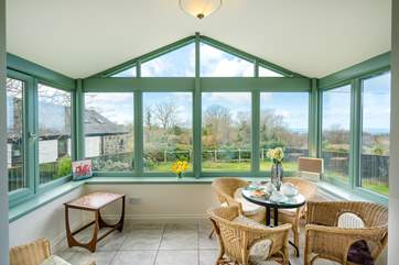 The spacious conservatory overlooks the front garden.