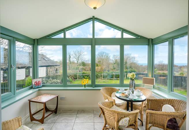 The spacious conservatory overlooks the front garden.
