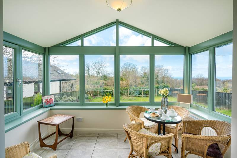 The spacious conservatory overlooks the front garden.