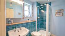 Calming blues in the attractive en suite shower-room.