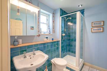 Calming blues in the attractive en suite shower-room.