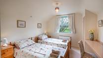 Enjoy the rural views from the sunny twin room on the first floor.