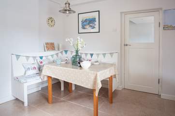 The kitchen /diner has a lovely coastal theme.