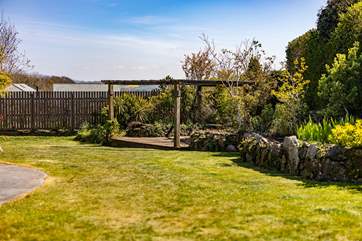 The garden stretches away from the house.