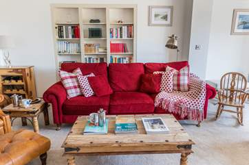 The sitting-room is cosy and comfy making the perfect room for a family film night in. The 49
