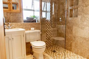 The beautiful shower-room also enjoys a heated towel rail.