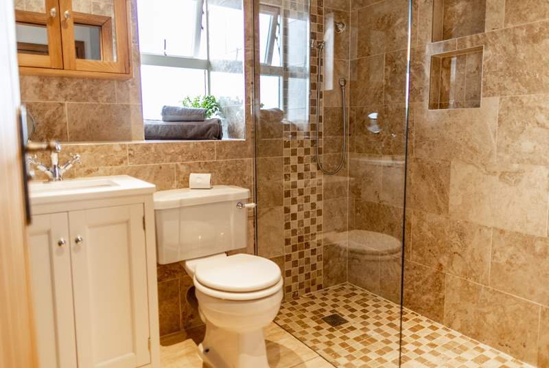 The beautiful shower-room also enjoys a heated towel rail.