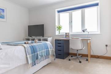Another room with a TV giving everyone the option to step back and relax in these beautiful bedrooms.