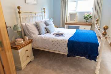 A lovely double bedroom furnished beautifully.
